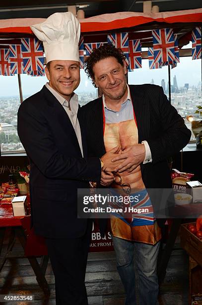 David Walliams and Marco Pierre White attend the Walkers 'Do Us A Flavour' finalists launch at Centrepoint on July 28, 2014 in London, England.