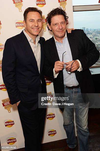 David Walliams and Marco Pierre White attend the Walkers 'Do Us A Flavour' finalists launch at Centrepoint on July 28, 2014 in London, England.