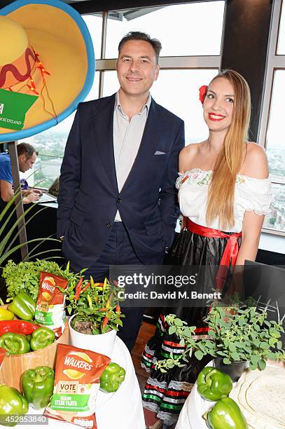 David Walliams poses with a finalist at the 'Walkers 'Do Us A Flavour' finalists launch at Paramount, Centre Point on July 28, 2014 in London,...