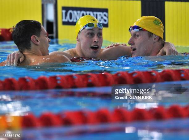 Australia's Mitch Larkin, Australia's Josh Beaver and Australia's Matson Lawson celebrate after taking gold, silver and bronze in the Men's 200m...