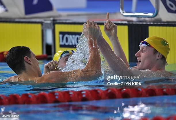 Australia's Mitch Larkin, Australia's Josh Beaver and Australia's Matson Lawson celebrate after taking gold, silver and bronze in the Men's 200m...