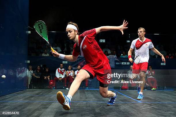 James Willstrop of England plays a shot against Nick Matthew of England during the Men's Singles Gold medal Final between Nick Matthew of England and...