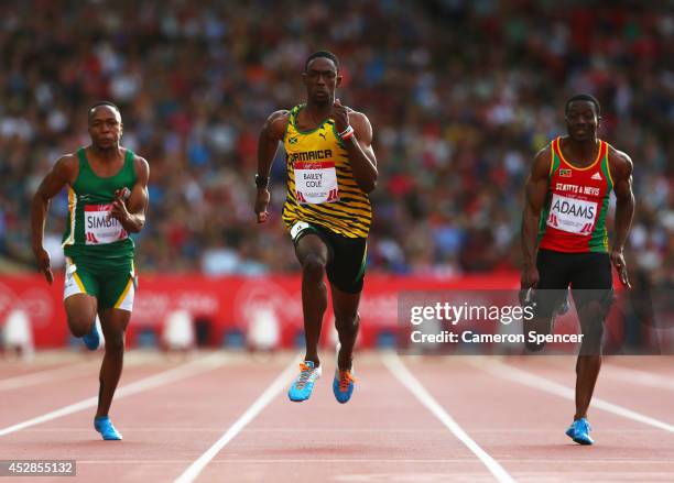 Akani Simbine of South Africa, Kemar Bailey-Cole of Jamaica and Antoine Adams of St Kitts and Nevis compete in the Men's 100 metres semi-final at...