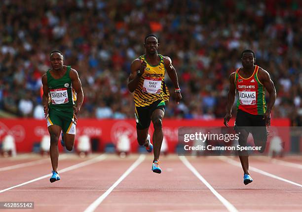 Akani Simbine of South Africa, Kemar Bailey-Cole of Jamaica and Antoine Adams of St Kitts and Nevis compete in the Men's 100 metres semi-final at...