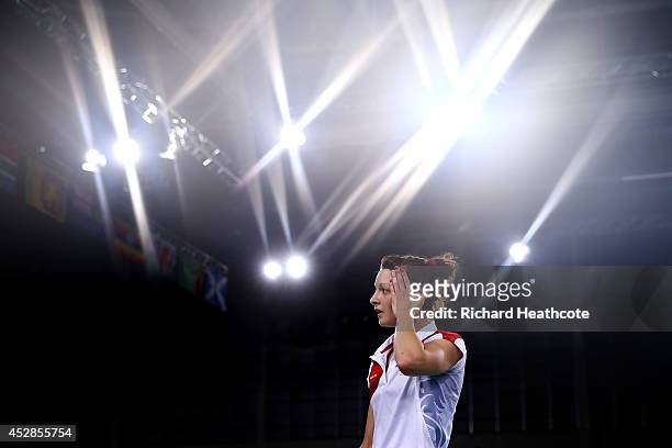 Sarah Walker of England in action against Jing Yi Tee of Malaysia in the women's singles during the Badminton Mixed Teams Gold Medal match at...