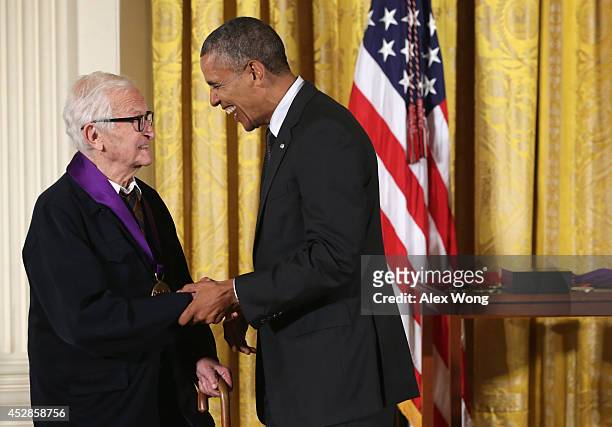 President Barack Obama presents the 2013 National Medal of Arts to filmmaker Albert Maysles during an East Room ceremony July 28, 2014 at the White...
