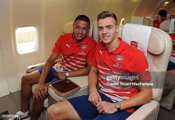 Arsenal's Alex Oxlade-Chamberlain and Calum Chambers board the team flight for Austria at Luton Airport on July 28, 2014 in Luton, England.