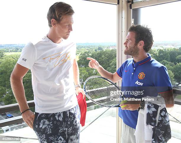 Juan Mata of Manchester United meets tennis player Tomas Berdych who is playing in the Citi Open, at their hotel on July 28, 2014 in Washington, DC.