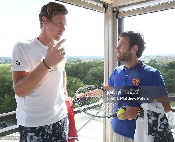 Juan Mata of Manchester United meets tennis player Tomas Berdych who is playing in the Citi Open, at their hotel on July 28, 2014 in Washington, DC.