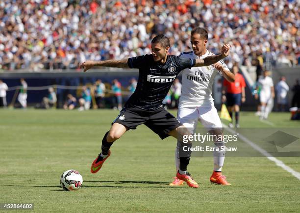 Mauro Icardi of FC Internazionale tries to keep the ball from Lucas Vazquez of Real Madrid during their match in the International Champions Cup 2014...