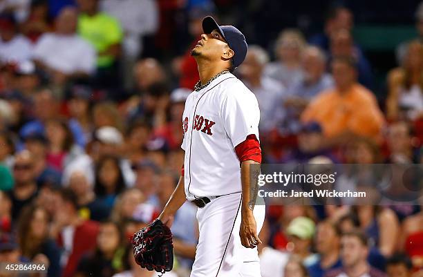 Felix Doubront of the Boston Red Sox reacts after giving up runs in the sixth inning against the Toronto Blue Jays during the game at Fenway Park on...