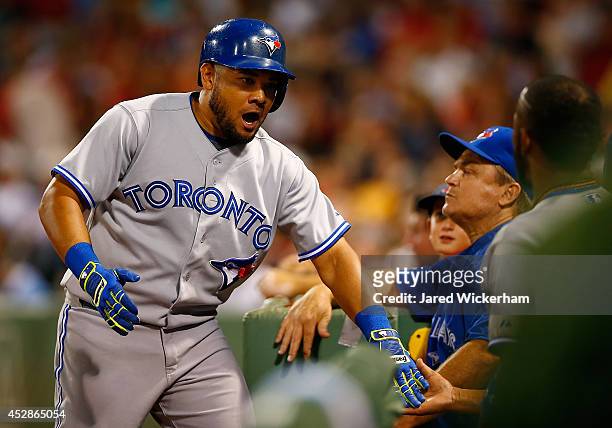 Melky Cabrera of the Toronto Blue Jays celebrates after hitting his second home run in the sixth inning against the Boston Red Sox during the game at...