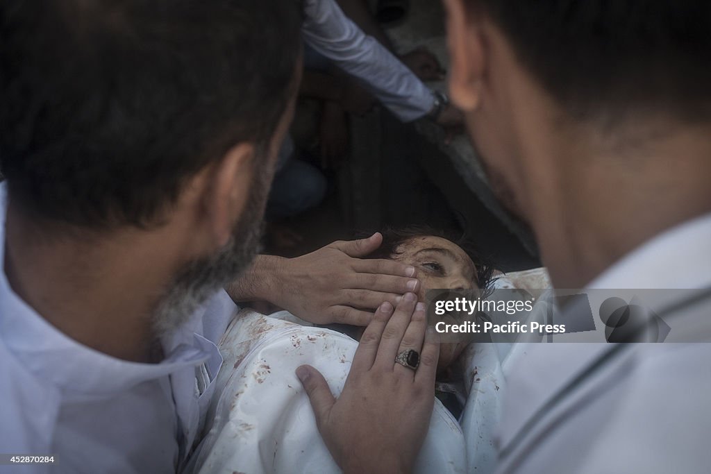 A child's  body, killed  in Gaza City during the celebration...