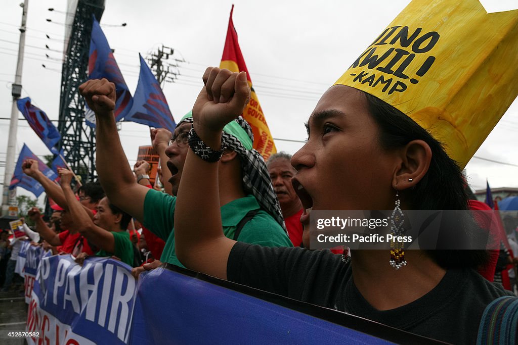 Protesters shout in anger as they march along Commonwealth...