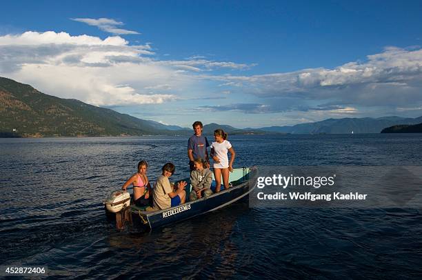 Idaho, Near Sandpoint, Lake Pend Oreille, Teenagers In Boat.