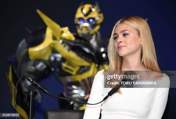 Actress Nicola Peltz answers questions during a press conference to promote her latest movie "Transformers: Age of Extinction" in Tokyo on July 29,...