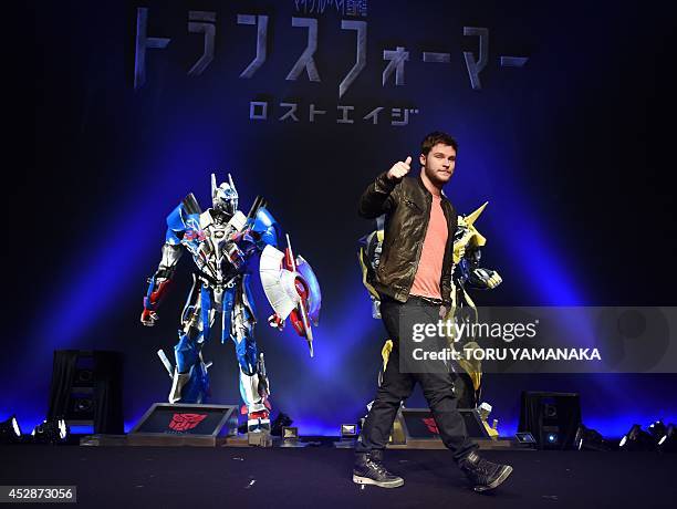 Hollywood actor Jack Reynor gives a thumbs up as he poses for photographers during a press conference to promote his latest movie "Transformers: Age...