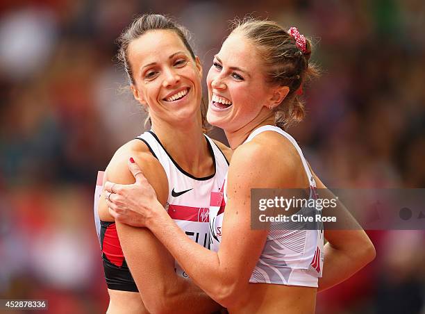 Jessica Zelinka of Canada hugs Jessica Tappin of England after competing in the Women's Heptathlon 100 metres hurdles at Hampden Park during day six...