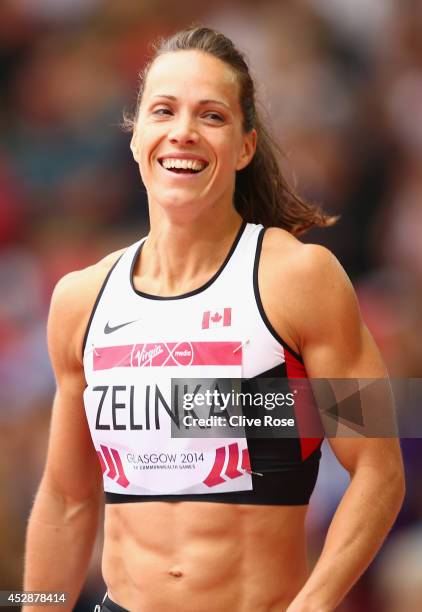 Jessica Zelinka of Canada smiles after competing in the Women's Heptathlon 100 metres hurdles at Hampden Park during day six of the Glasgow 2014...