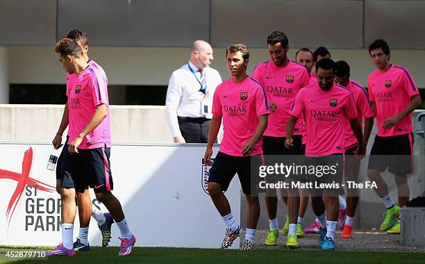 Barcelona players arrive ahead of a Barcelona Training Session at St Georges Park on July 29, 2014 in Burton-upon-Trent, England.