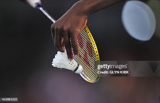 Ghana's Sam Daniel serves during a Badminton Men's singles match against Aatish Lubah of Mauritius at the Emirates Arena during the 2014 Commonwealth...