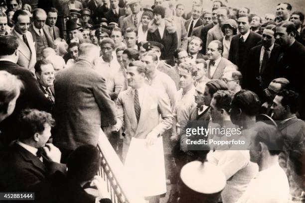 The Uruguay team, led by their captain Jose Nasazzi, are greeted by FIFA President Jules Rimet during the opening ceremony of the 1930 World Cup...