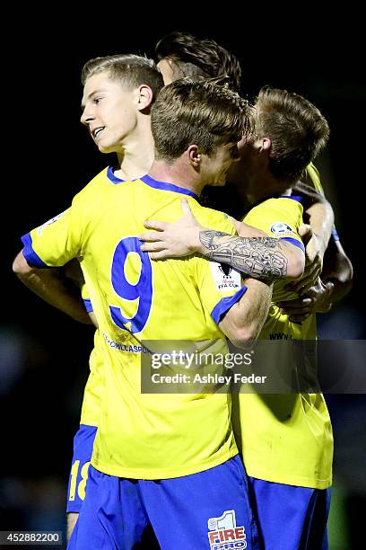 Brisbane Strikers teammates celebrate a goal during the FFA Cup match between Broadmeadow and Brisbane Strikers at Wanderers Oval on July 29, 2014 in...