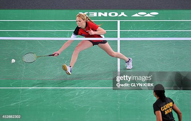 Sofia Arkhipkina of the Falklands Islands in action during her women's singles badminton match against Jamaica's Geordine Henry in the Emirates Arena...