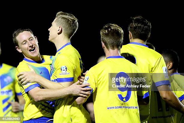 Brisbane Strikers teammates celebrate a goal during the FFA Cup match between Broadmeadow and Brisbane Strikers at Wanderers Oval on July 29, 2014 in...