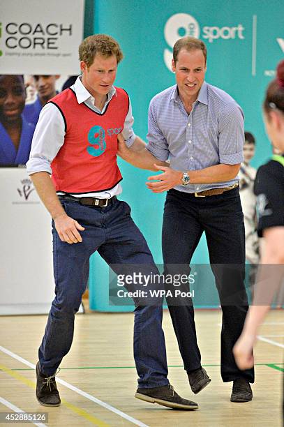 Prince Harry and Prince William, Duke of Cambridge play 5 a side football during a visit to the Coach Core project at Gorbals Leisure Centre on July...