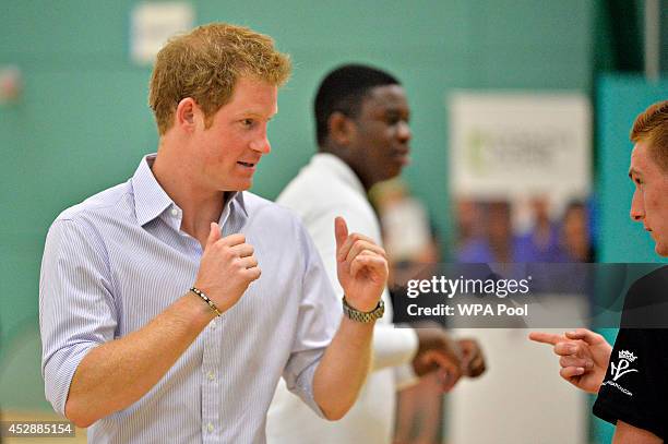 Prince Harry tries his hand at boxing as he and Prince William, Duke of Cambridge visit a Coach Core project at Gorbals Leisure Centre on July 29,...