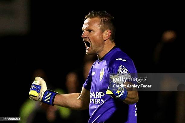 Chris Bowling goalkeeper of Broadmeadow celebrates after saving a penalty during the FFA Cup match between Broadmeadow and Brisbane Strikers at...