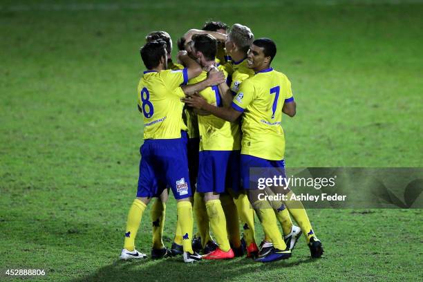 Brisbane Strikers teammates celebrate a goal during the FFA Cup match between Broadmeadow and Brisbane Strikers at Wanderers Oval on July 29, 2014 in...