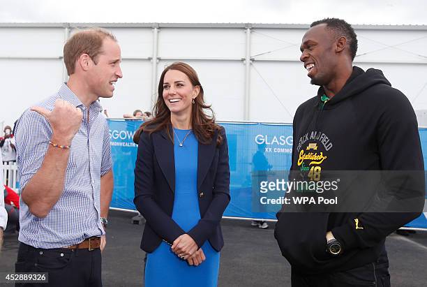 Prince William, Duke of Cambridge and Catherine, Duchess of Cambridge meet Usain Bolt during a visit to the Commonwealth Games Village on July 29,...