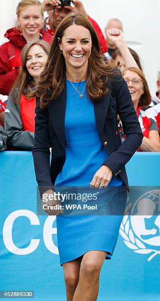 Catherine, Duchess of Cambridge plays the South African game of Three Tins during a visit to the Commonwealth Games Village on July 29, 2014 in...