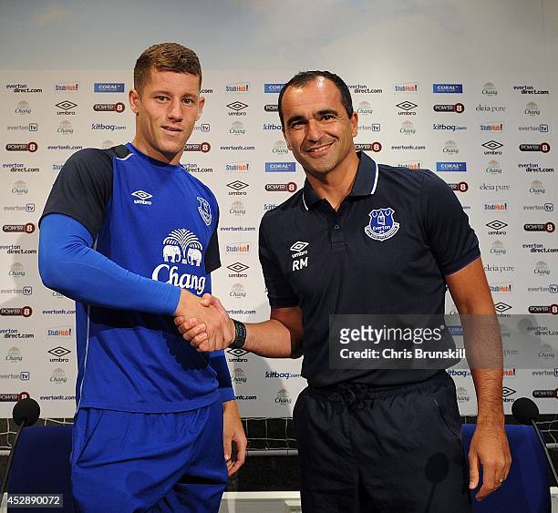 Everton manager Roberto Martinez shakes hands with Ross Barkley during a press conference at Finch Farm on July 29, 2014 in Liverpool, England.