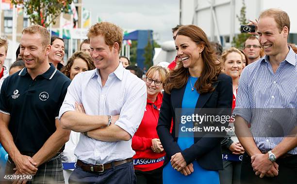 Sir Chris Hoy, Prince Harry, Catherine, Duchess of Cambridge and Prince William, Duke of Cambridge look on during a visit to the Commonwealth Games...