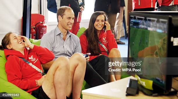 Prince William, Duke of Cambridge plays a computer game during a visit to the Commonwealth Games Village on July 29, 2014 in Glasgow, Scotland.