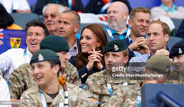 Lord Sebastian Coe, Catherine, Duchess of Cambridge and Prince William, Duke of Cambridge watch the athletics at Hampden Park during the 20th...