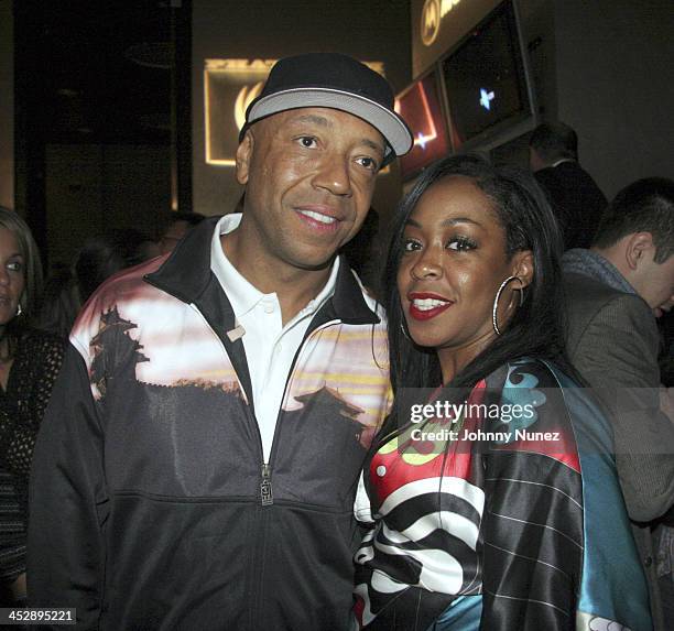 Russell Simmons and Tashina Arnold during Phat Farm Party for Magic 06 - February 22, 2006 at Palm Hotel Hard wood Suite in Las Vegas, Nerevada,...