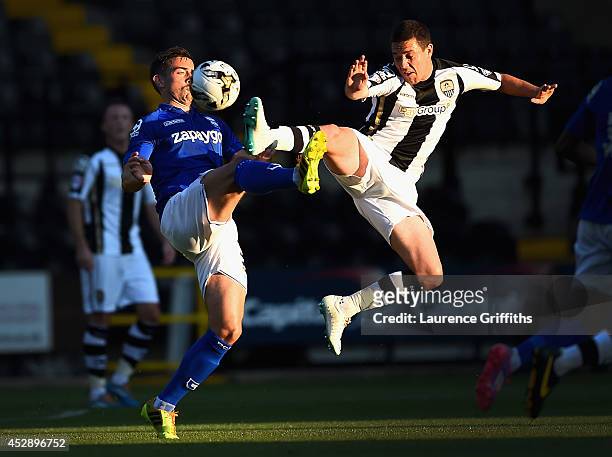 Oliver Lee of Birmingham City battles with Liam Noble of Notts County during the Pre Season Friendly match between Notts County and Birmingham City...