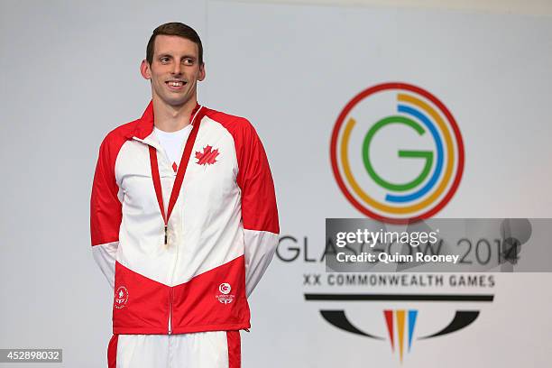 Gold medallist Ryan Cochrane of Canada poses during the medal ceremony for the Men's 1500m Freestyle Final at Tollcross International Swimming Centre...