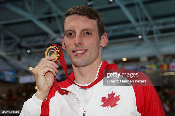 Gold medallist Ryan Cochrane of Canada poses after the medal ceremony for the Men's 1500m Freestyle Final at Tollcross International Swimming Centre...