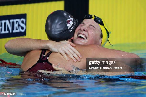 Cate Campbell of Australia celebrates winning the gold medal with silver medallist Francesca Halsall of England in the Women's 4 x 100m Medley Relay...