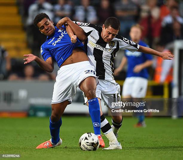 Tom Adeyemi of Birmingham City battles with Liam Noble of Notts County during the Pre Season Friendly match between Notts County and Birmingham City...