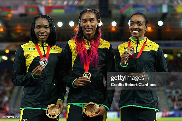 Silver medallist Novlene Williams-Mills of Jamaica, Gold medallist Stephanie McPherson of Jamaica and bronze medallist Christine Day of Jamaica pose...