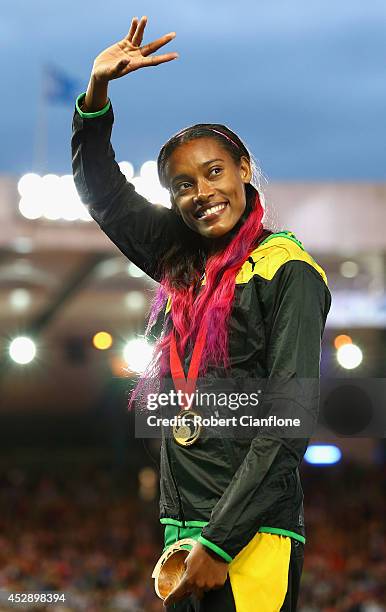 Gold medallist Stephanie McPherson of Jamaica poses on the podium during the medal ceremony for the Womens 400 metres at Hampden Park during day six...