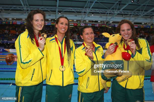 Gold medallists Cate Campbell, Emma McKeon, Lorna Tonks and Emily Seebohm of Australia pose after the medal ceremony for the Women's 4 x 100m Medley...