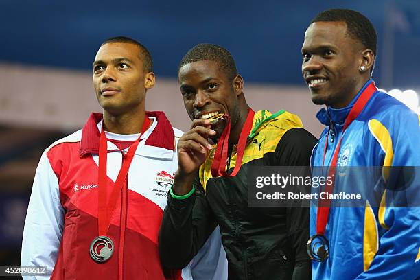 Silver medallist William Sharman of England, Gold medallist Andrew Riley of Jamaica and bronze medallist Shane Brathwaite of Barbados pose on the...