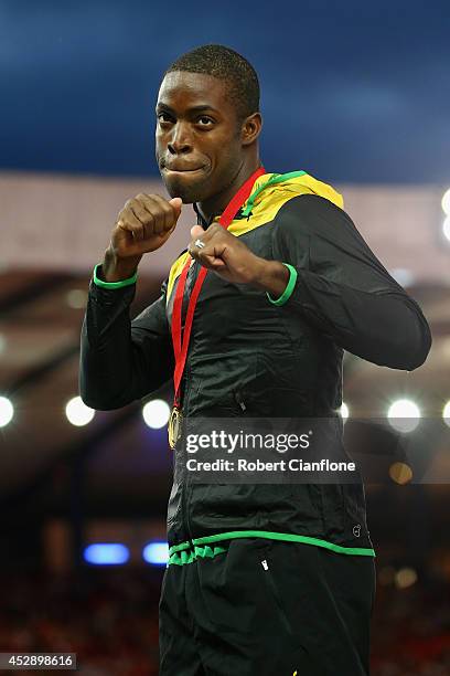 Gold medallist Andrew Riley of Jamaica poses on the podium during the medal ceremony for the Mens 110 metre hurdles at Hampden Park during day six...